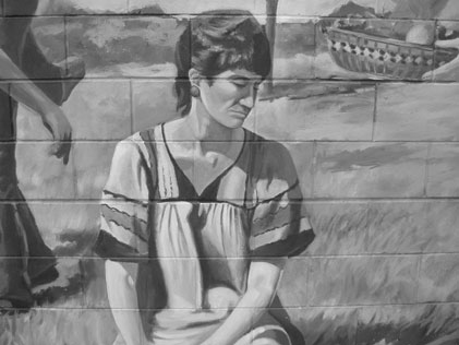 mural close up on sad woman